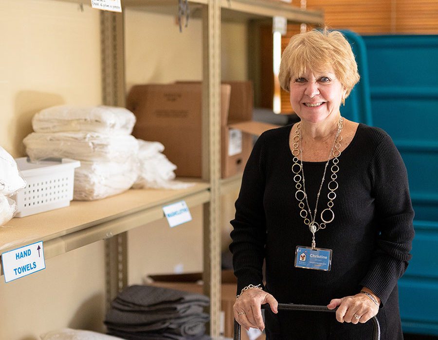 volunteer in organized storage room