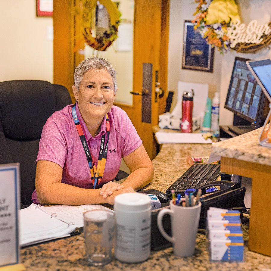 worker at guest services desk