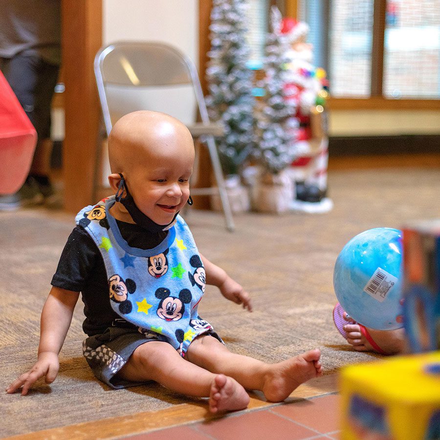 child playing at christmas in july event