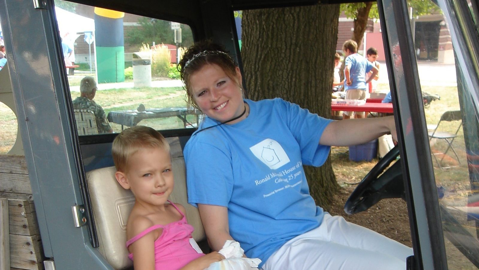 Connie Cripe smiles next to child