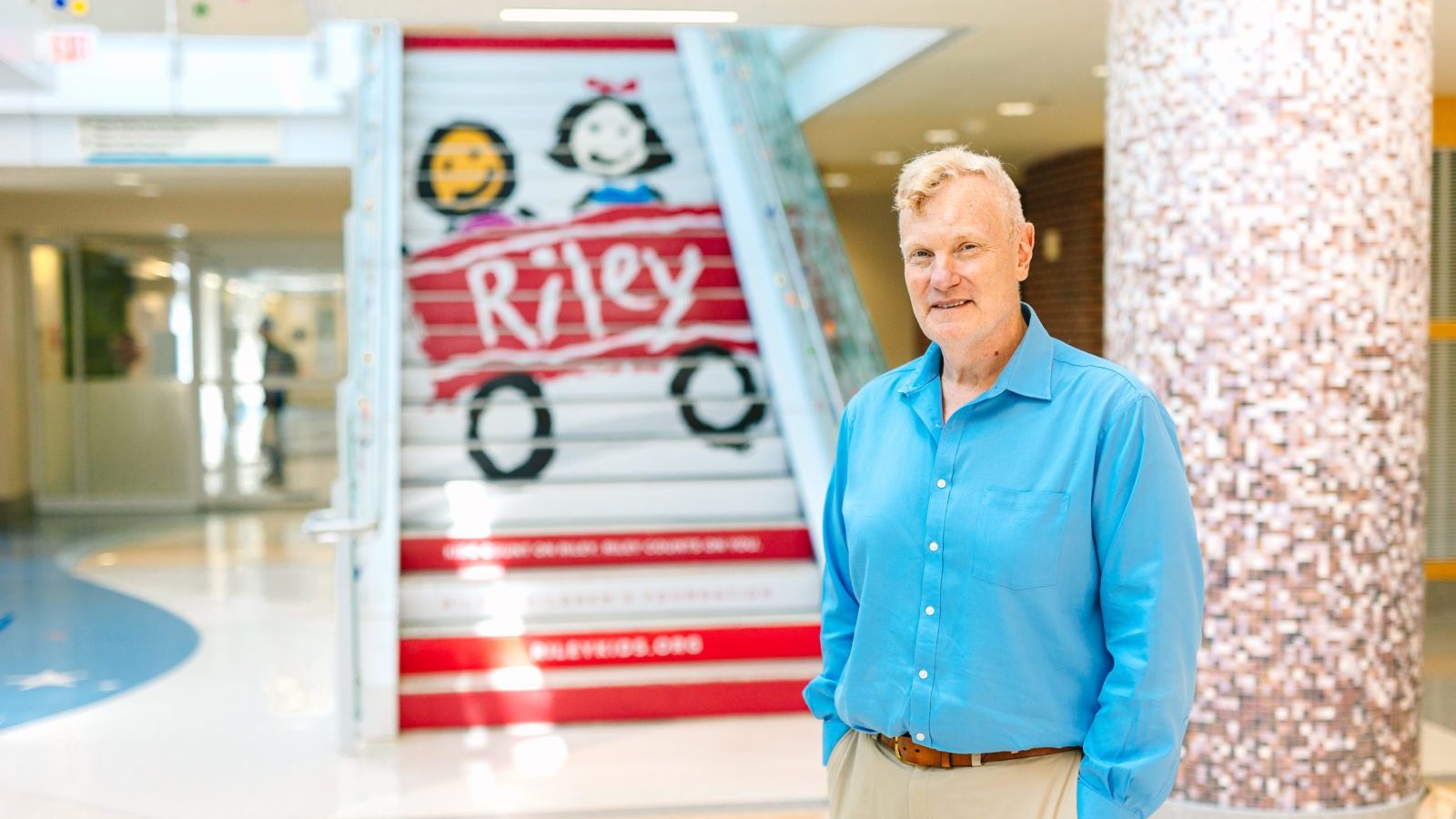 Andy Harner smiles for the camera inside Riley Hospital