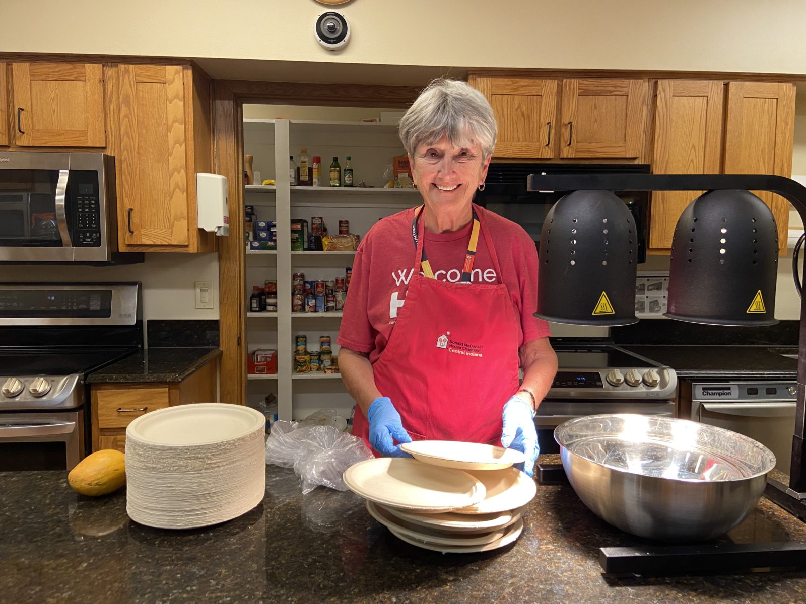 Marsha prepares a meal as a culinary crew volunteer.
